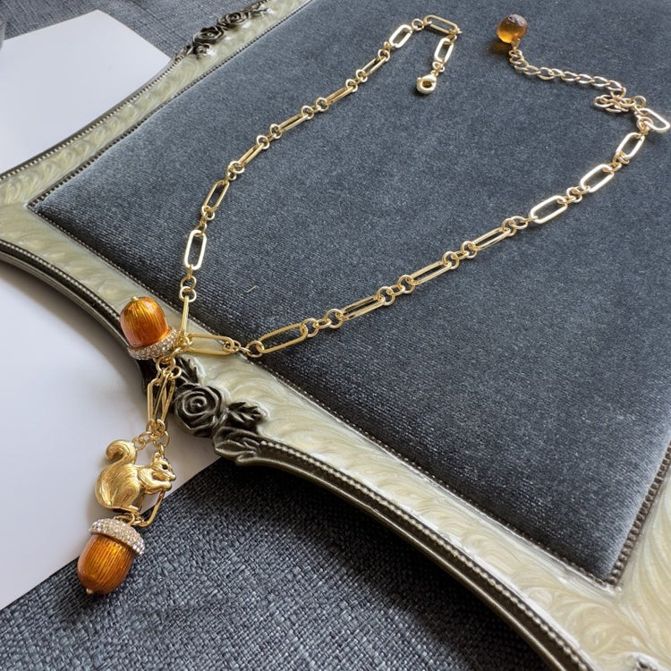 Vintage-Inspired Squirrel & Orange Charm Necklace – Gold Tone