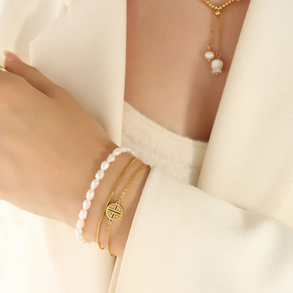 Three-Layer Freshwater Pearl & Titanium Steel Bracelet – Gold Tone