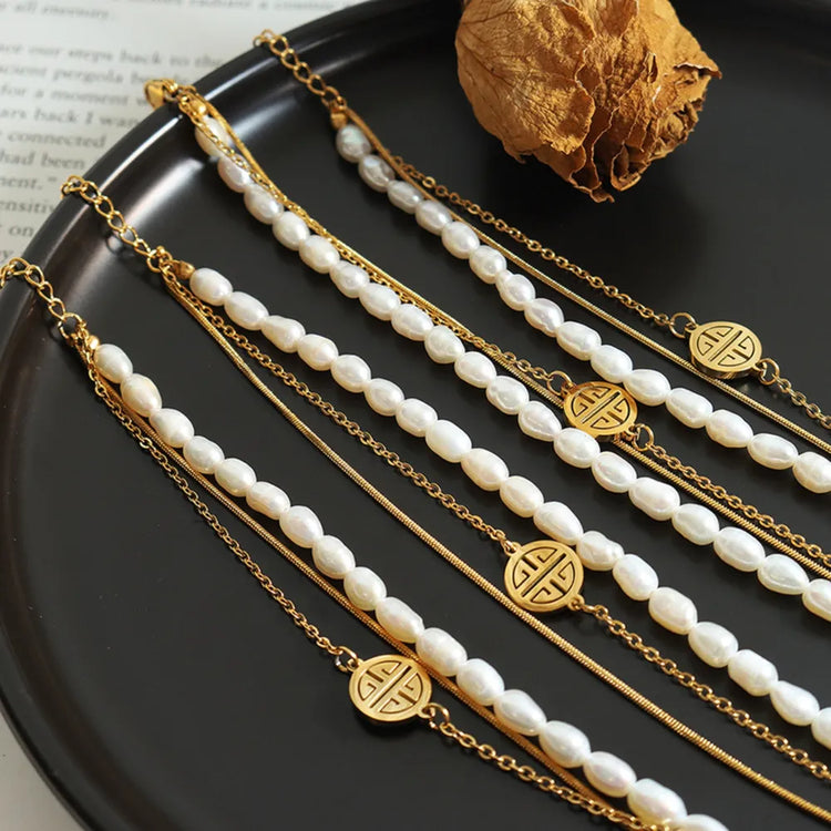 Three-Layer Freshwater Pearl & Titanium Steel Bracelet – Gold Tone